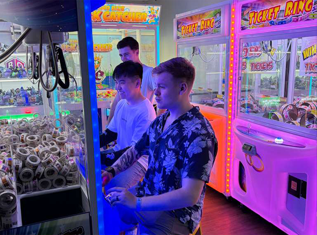 kids playing with claw machine